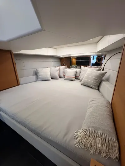 Argento Yacht Photos Pics Luxurious interior cabin of 2023 Wally 48 X yacht with plush bedding and cushions.