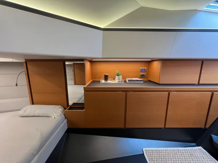 Argento Yacht Photos Pics Luxurious interior of 2023 Wally 48 X yacht with modern wood cabinetry and cozy bed.