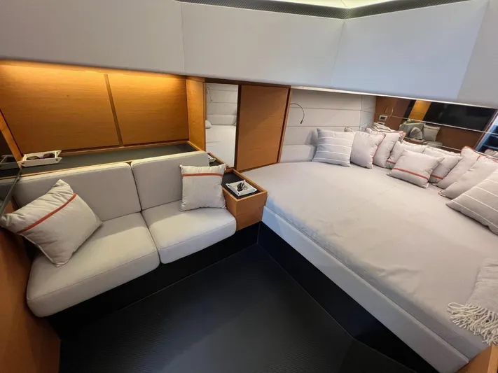 Argento Yacht Photos Pics Luxurious interior of 2023 Wally 48 X yacht with modern seating and plush bedding.