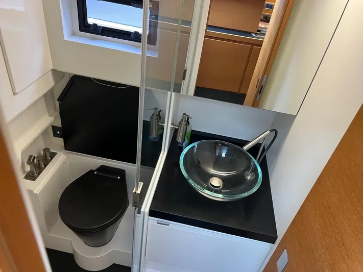 Argento Yacht Photos Pics Modern bathroom in 2023 Wally 48 X yacht with glass sink and sleek fixtures.