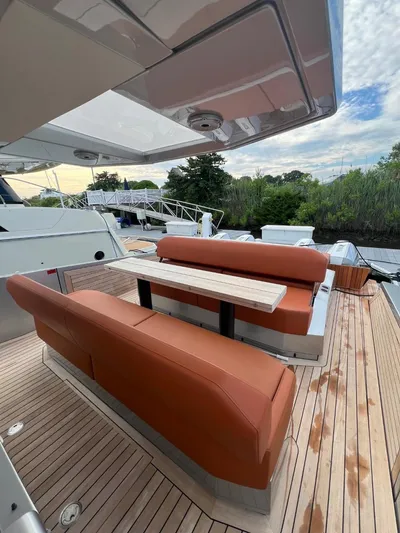 Argento Yacht Photos Pics Luxury yacht Wally 48 X 2023 with elegant outdoor seating and wooden deck.