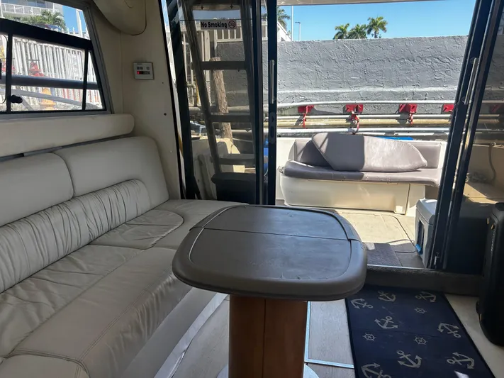  Yacht Photos Pics Interior of 2003 Cranchi Atlantique 40 yacht with seating and table.