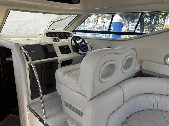  Yacht Photos Pics Interior of 2003 Cranchi Atlantique 40 yacht with plush seating and modern dashboard.