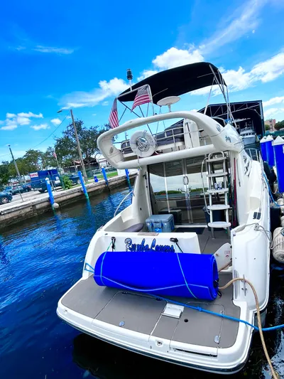  Yacht Photos Pics 2003 Cranchi Atlantique 40 yacht docked at marina under clear blue sky.