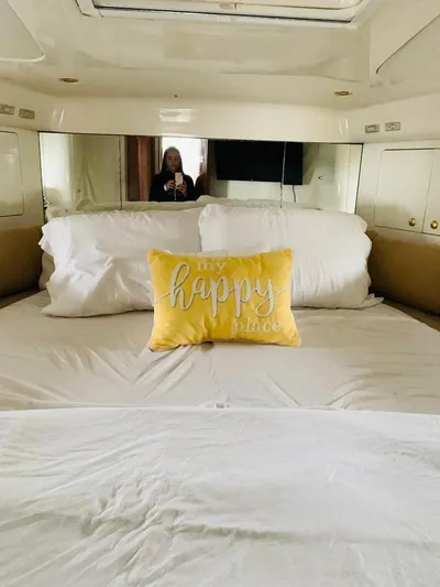  Yacht Photos Pics Cozy bedroom in 2003 Cranchi Atlantique 40 yacht with decorative pillows.