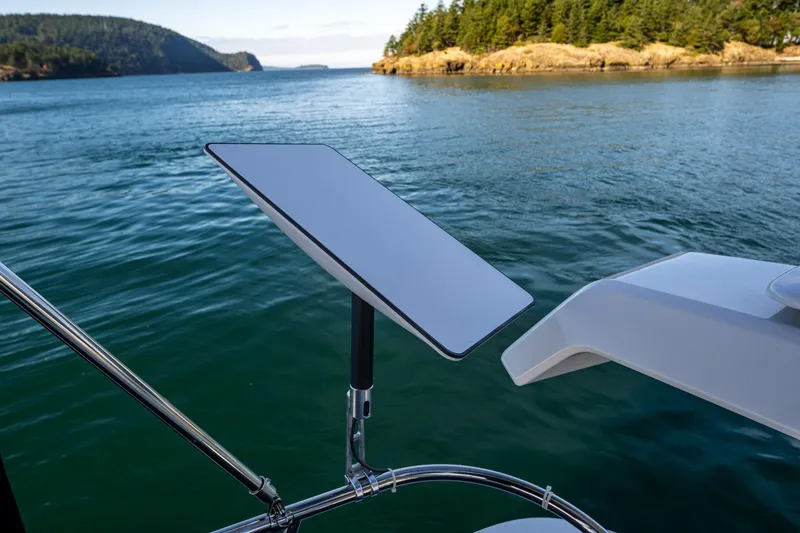 Endeavour Yacht Photos Pics Nimbus 405 Flybridge 2023 with satellite dish on scenic waterway.