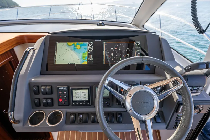Endeavour Yacht Photos Pics Cockpit of 2023 Nimbus 405 Flybridge with advanced navigation system and steering wheel.