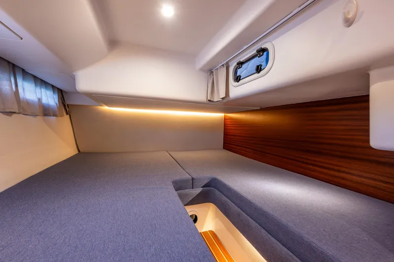 Endeavour Yacht Photos Pics Luxurious interior cabin of 2023 Nimbus 405 Flybridge yacht with cozy bedding.