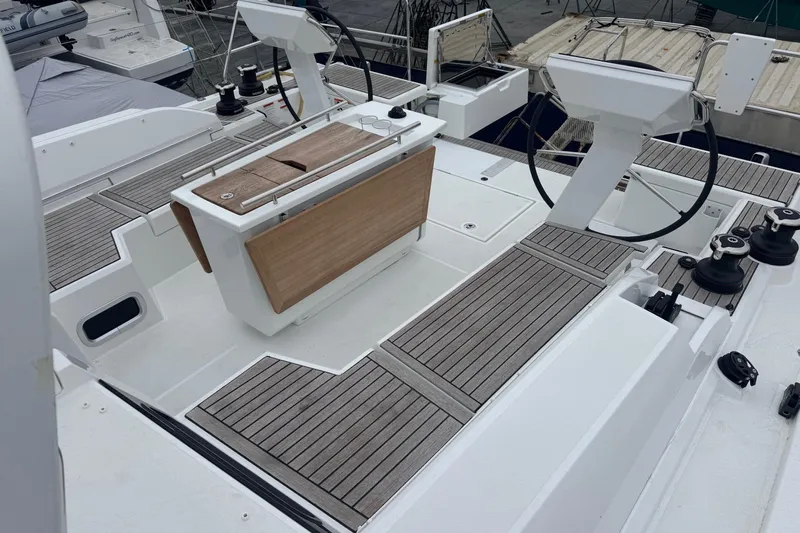  Yacht Photos Pics 2024 Beneteau Oceanis 46.1 yacht cockpit with dual steering wheels and teak decking.