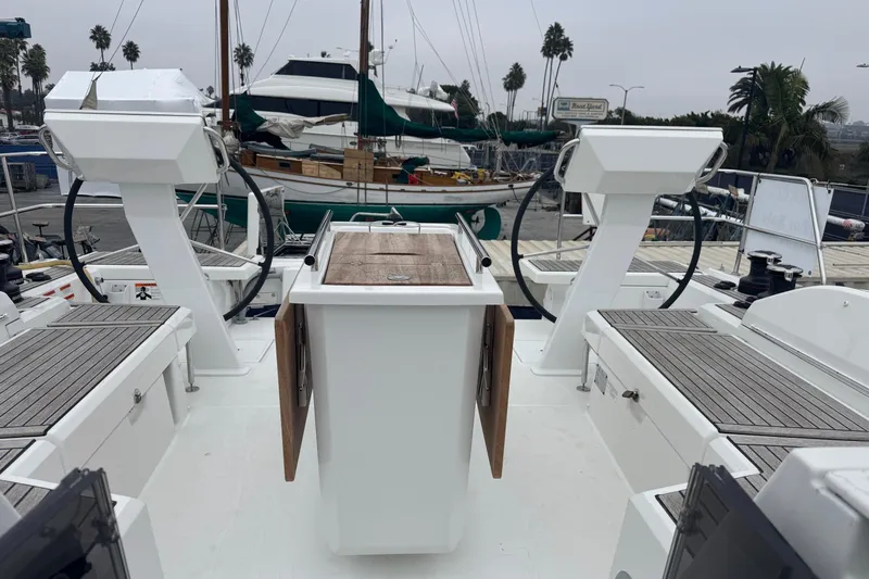  Yacht Photos Pics 2024 Beneteau Oceanis 46.1 yacht deck with dual helm stations and wooden accents.