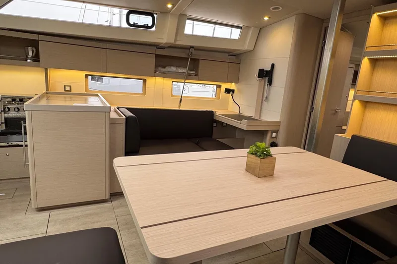  Yacht Photos Pics Interior of 2024 Beneteau Oceanis 46.1 yacht, featuring modern dining area and sleek design.