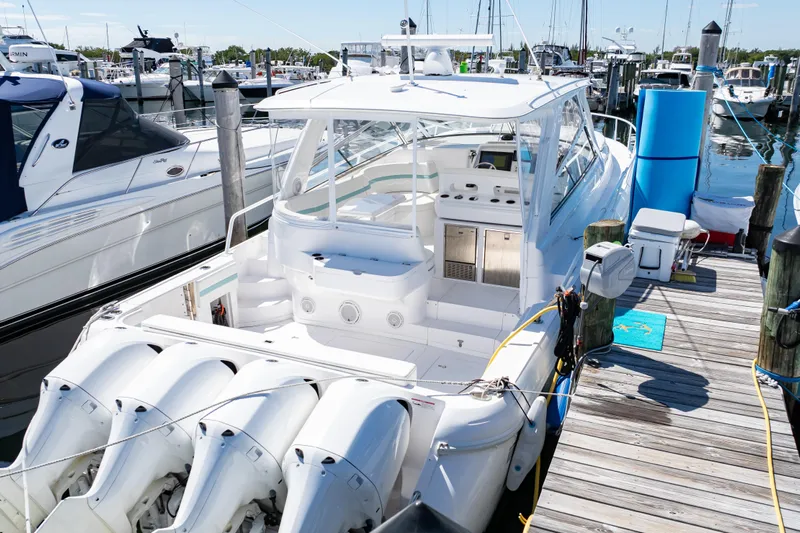  Yacht Photos Pics 2018 Intrepid 475 Sport Yacht docked at marina with multiple outboard engines.