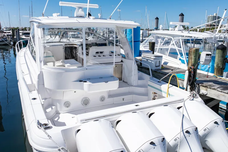  Yacht Photos Pics 2018 Intrepid 475 Sport Yacht docked at marina, showcasing sleek design and powerful engines.