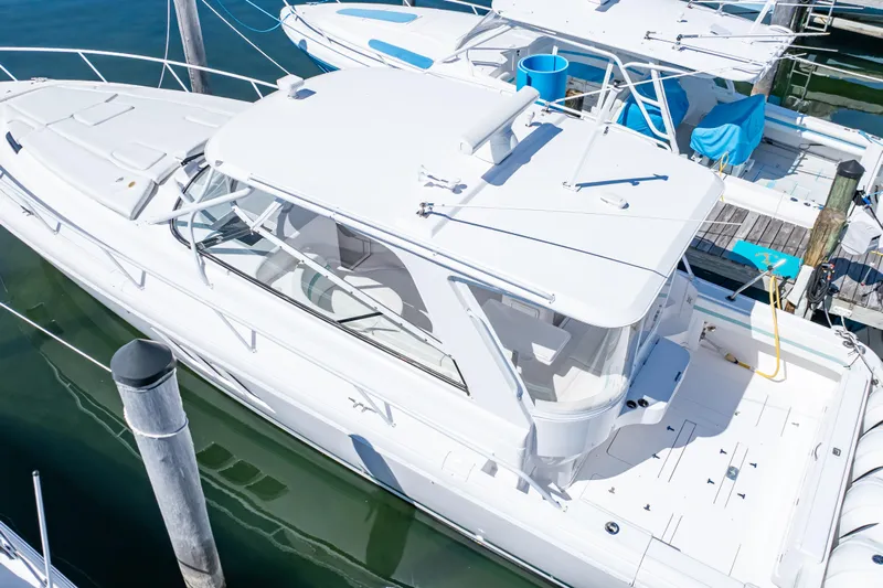  Yacht Photos Pics 2018 Intrepid 475 Sport Yacht docked at marina, aerial view.