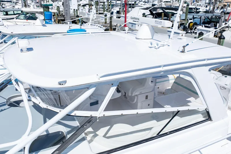  Yacht Photos Pics 2018 Intrepid 475 Sport Yacht docked, showcasing sleek design and modern features.