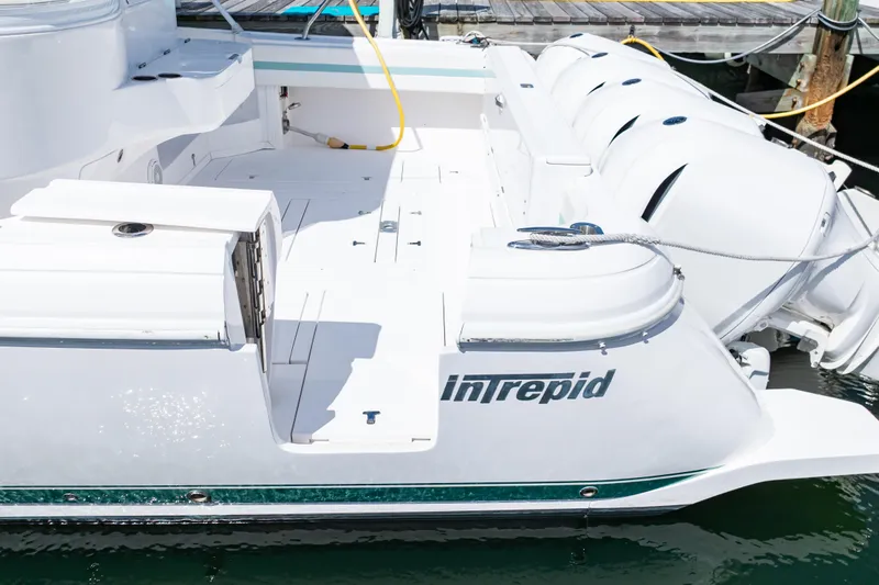  Yacht Photos Pics 2018 Intrepid 475 Sport Yacht docked, showcasing sleek design and powerful engines.