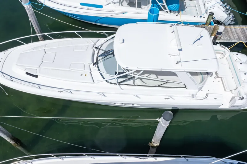  Yacht Photos Pics 2018 Intrepid 475 Sport Yacht docked in marina, aerial view.