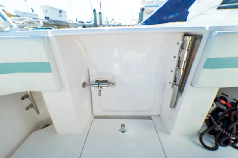  Yacht Photos Pics 2018 Intrepid 475 Sport Yacht deck area with storage compartment and fittings.