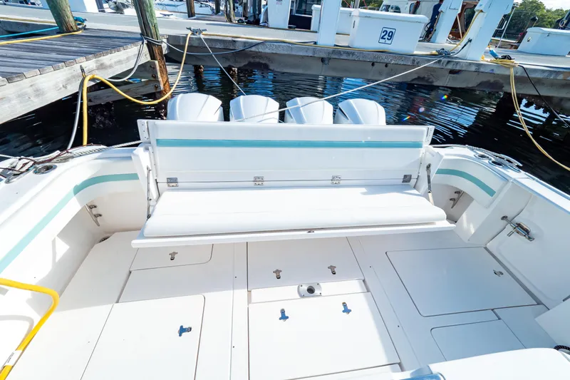  Yacht Photos Pics 2018 Intrepid 475 Sport Yacht with spacious deck and seating at marina.