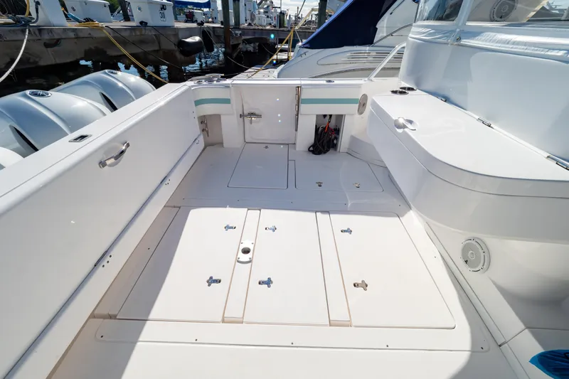  Yacht Photos Pics 2018 Intrepid 475 Sport Yacht deck with storage compartments and seating.
