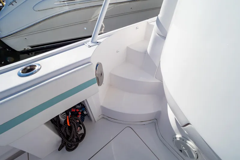  Yacht Photos Pics 2018 Intrepid 475 Sport Yacht deck with steps and storage compartment.