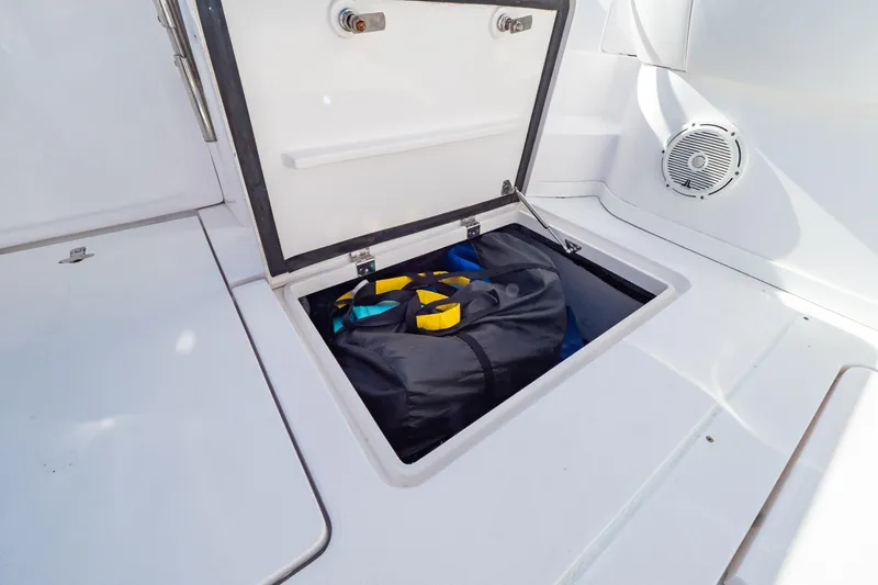  Yacht Photos Pics Storage compartment on 2018 Intrepid 475 Sport Yacht with gear bag inside.