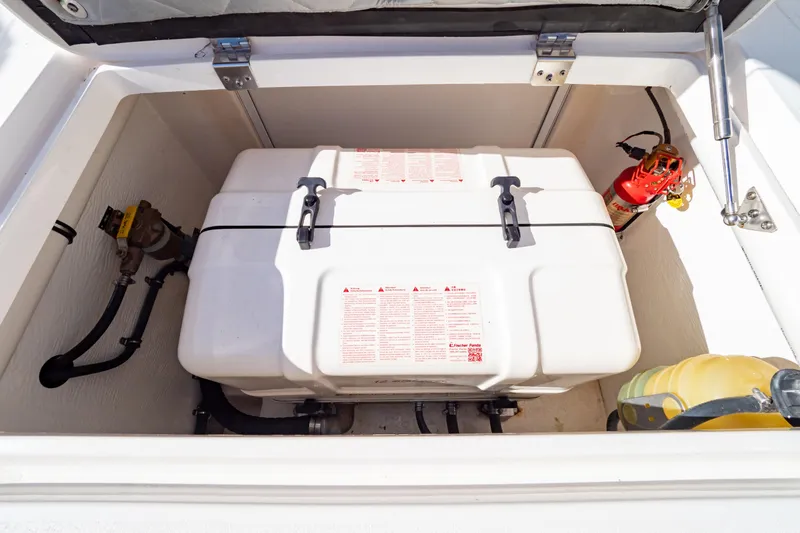  Yacht Photos Pics Storage compartment of a 2018 Intrepid 475 Sport Yacht with equipment and fire extinguisher.