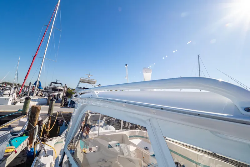 Yacht Photos Pics 2018 Intrepid 475 Sport Yacht docked under clear blue sky.