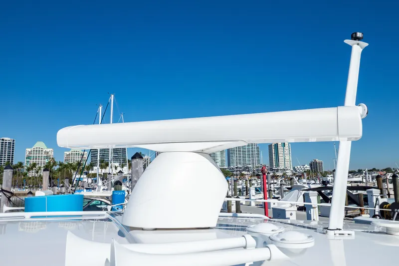  Yacht Photos Pics 2018 Intrepid 475 Sport Yacht radar system with marina and city skyline background.