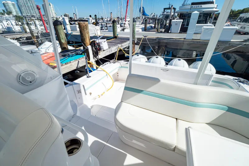  Yacht Photos Pics 2018 Intrepid 475 Sport Yacht docked at marina, featuring spacious seating and sleek design.