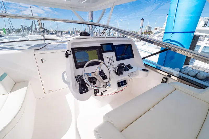  Yacht Photos Pics 2018 Intrepid 475 Sport Yacht helm with modern navigation equipment and luxurious seating.