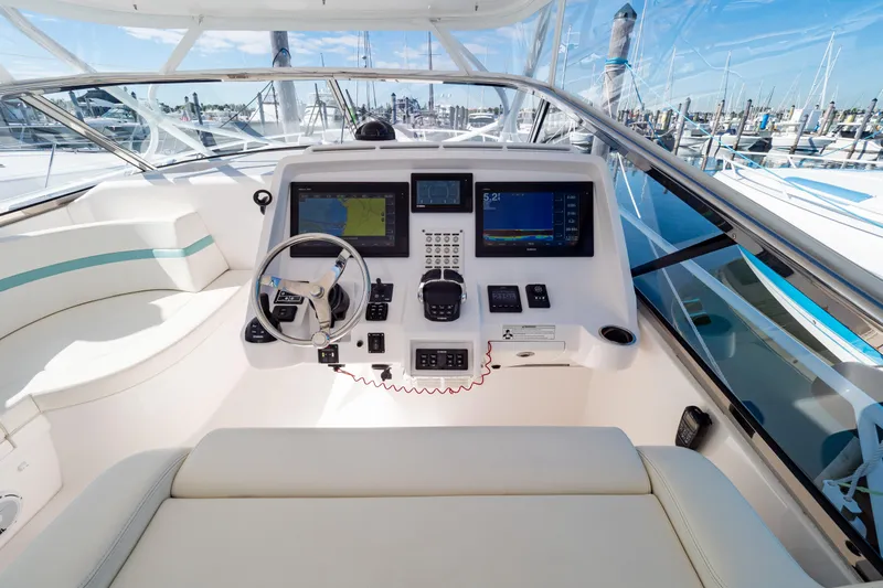  Yacht Photos Pics 2018 Intrepid 475 Sport Yacht cockpit with modern navigation equipment and luxurious seating.