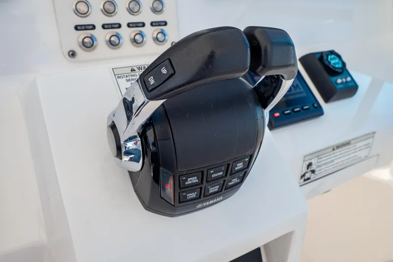  Yacht Photos Pics Control panel of a 2018 Intrepid 475 Sport Yacht with throttle and buttons.