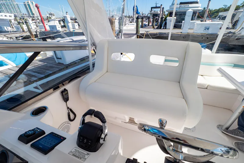  Yacht Photos Pics 2018 Intrepid 475 Sport Yacht cockpit with white seating and control panel.