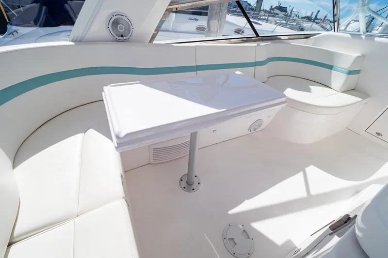  Yacht Photos Pics Luxurious seating area on 2018 Intrepid 475 Sport Yacht with white and teal accents.