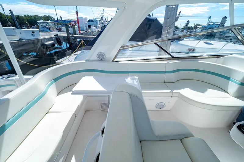  Yacht Photos Pics Luxurious seating area on a 2018 Intrepid 475 Sport Yacht, docked at a marina.