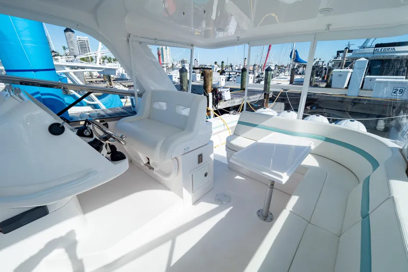  Yacht Photos Pics Luxurious 2018 Intrepid 475 Sport Yacht interior with seating and helm, docked at marina.