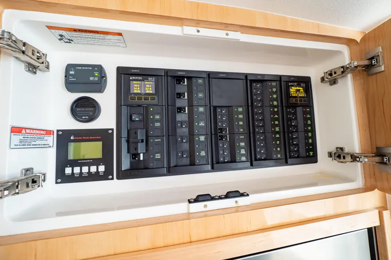  Yacht Photos Pics Electrical control panel on 2018 Intrepid 475 Sport Yacht, featuring various switches and indicators.