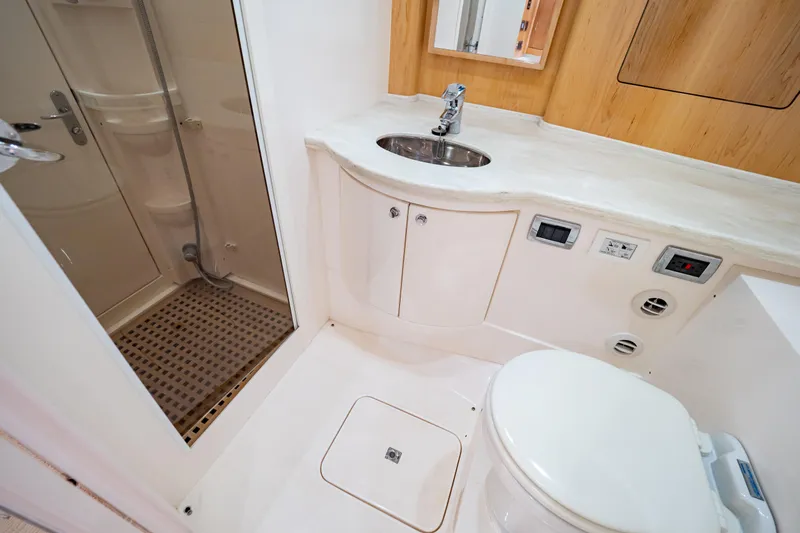  Yacht Photos Pics Luxurious bathroom in 2018 Intrepid 475 Sport Yacht with shower, sink, and toilet.