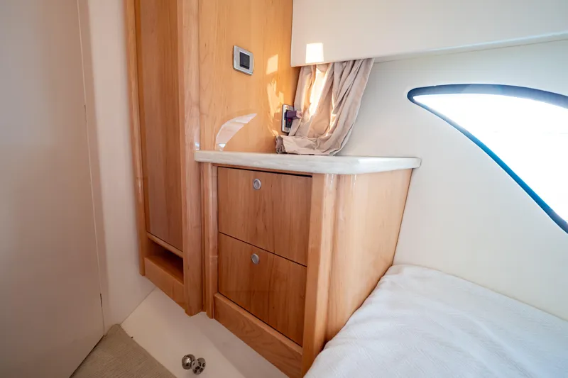  Yacht Photos Pics Interior of 2018 Intrepid 475 Sport Yacht with wooden cabinetry and natural light.