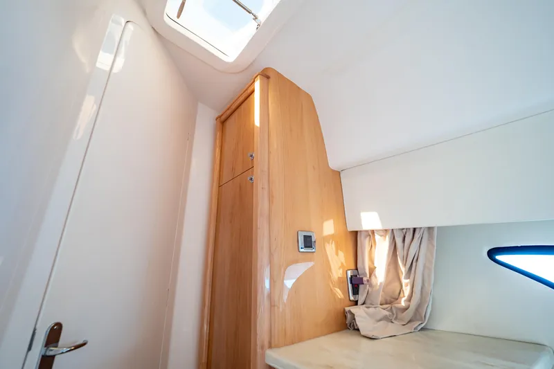  Yacht Photos Pics Interior of 2018 Intrepid 475 Sport Yacht with wooden cabinetry and skylight.