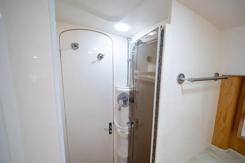  Yacht Photos Pics 2018 Intrepid 475 Sport Yacht bathroom with shower and towel rack.