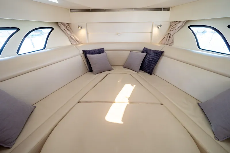  Yacht Photos Pics Luxurious interior of 2018 Intrepid 475 Sport Yacht with plush seating and cushions.