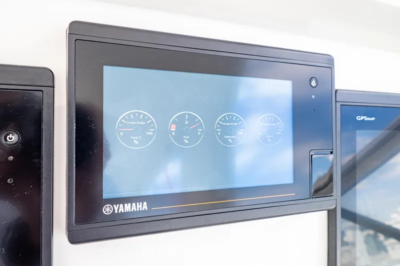  Yacht Photos Pics Yamaha display panel on 2018 Intrepid 475 Sport Yacht dashboard showing gauges.