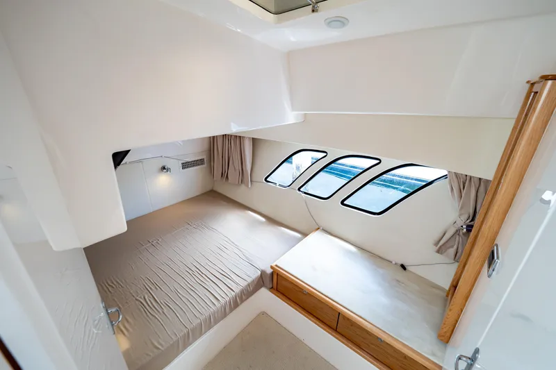  Yacht Photos Pics Luxurious cabin interior of 2018 Intrepid 475 Sport Yacht with modern design and ample natural light.