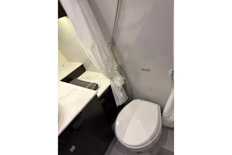  Yacht Photos Pics 2023 Cruisers Yachts 38 GLS OB bathroom with modern fixtures and sleek design.