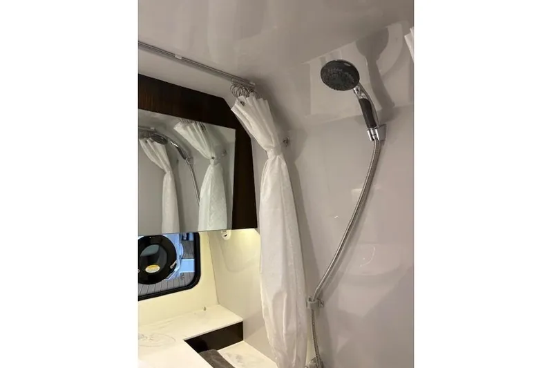  Yacht Photos Pics 2023 Cruisers Yachts 38 GLS OB bathroom with shower and mirror.