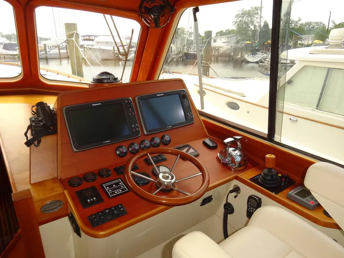 Fine Time Yacht Photos Pics Helm of 2002 Hinckley Talaria 44 FB with dual screens and wooden steering wheel.