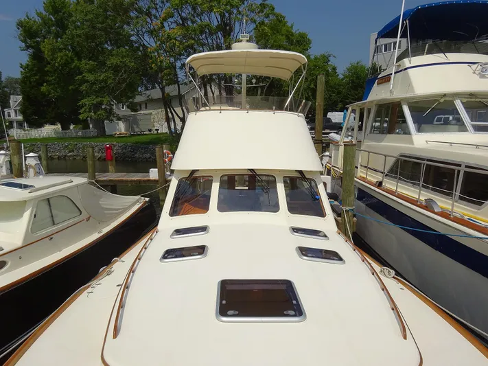 Fine Time Yacht Photos Pics Hinckley Talaria 44 FB 2002 yacht docked, showcasing sleek design and spacious deck.
