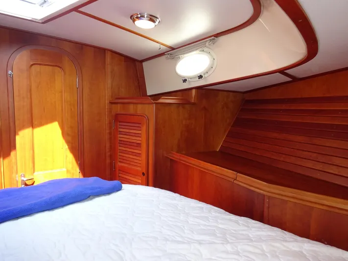 Fine Time Yacht Photos Pics Interior cabin of 2002 Hinckley Talaria 44 FB yacht with wooden finish.